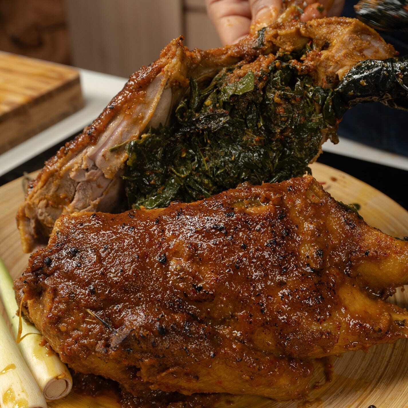 Slow-cooked duck wrapped in banana leaves and infused with a complex blend of spices
